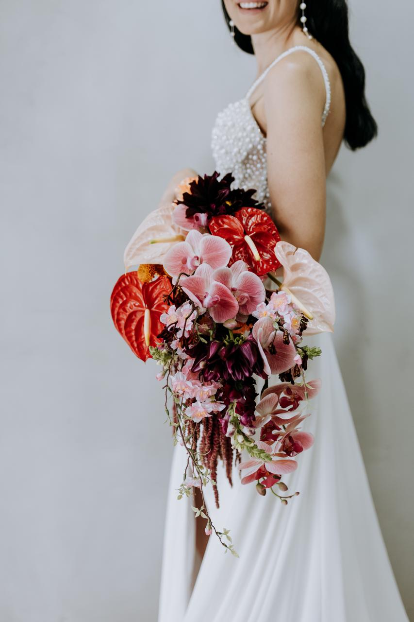 Bride holding cascading bouquet